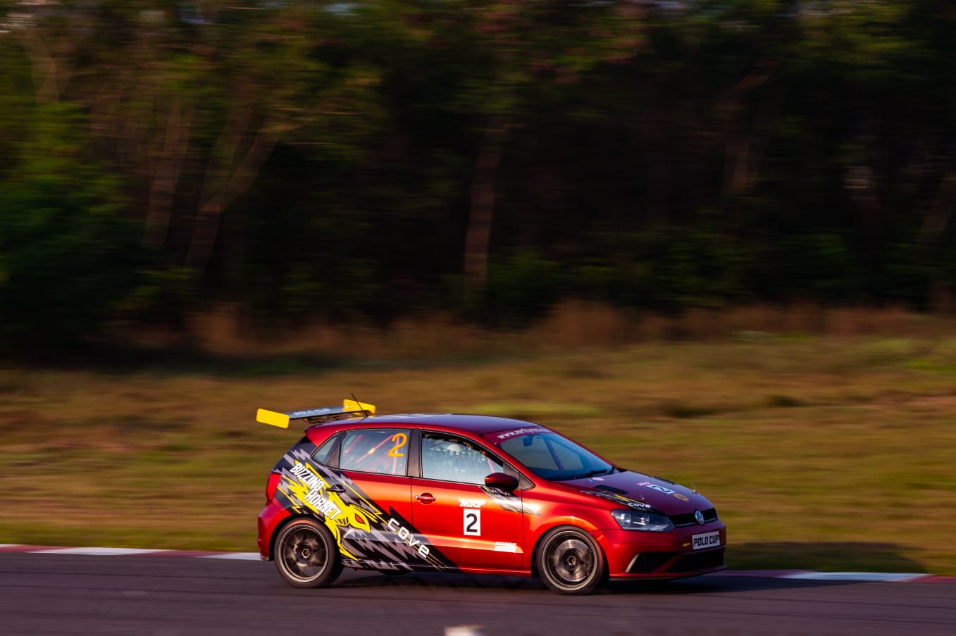 Avi Malavalli racing a touring car at speed
